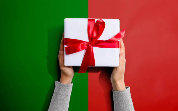 istock Person holding a Christmast gift box 1200327634