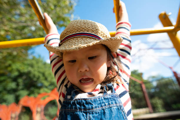istock Little girl playing in the park 1200328501