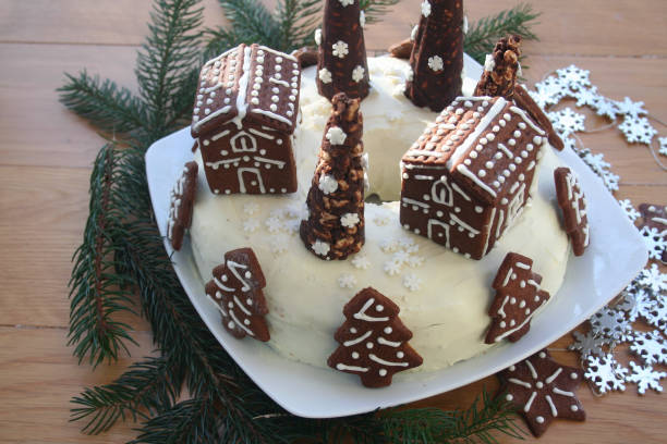 istock Chocolate cake covered by white cheese cream with decorated cookies 1200328703