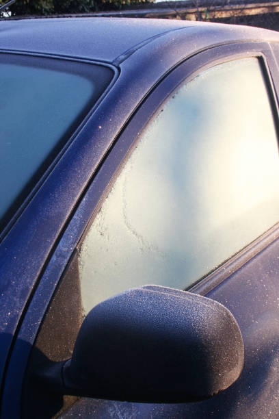 istock Blue car covered by frost on winter season. 1200328802