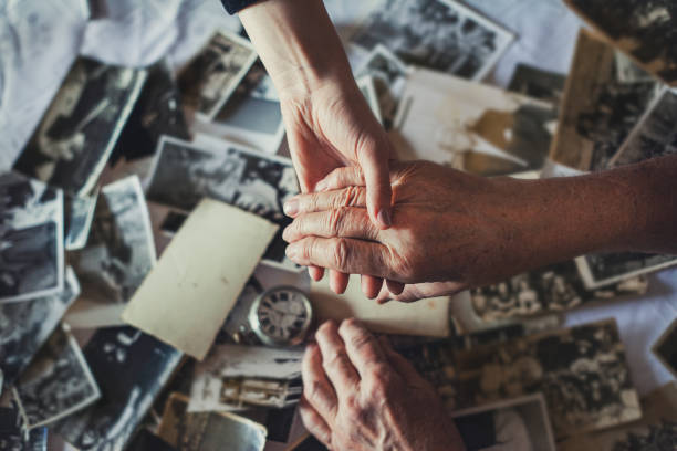 istock Holding hand -  grandson and grandfather 1200328883