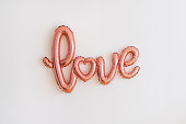 Pink foil balloon - word LOVE