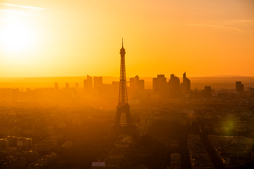 Sunset over the Eiffel Tower and the cityscape of Paris.
