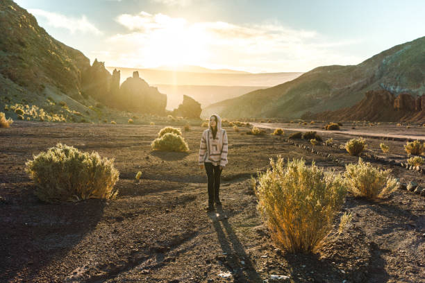 istock Woman walking in Atacama desert in Chile 1200334790