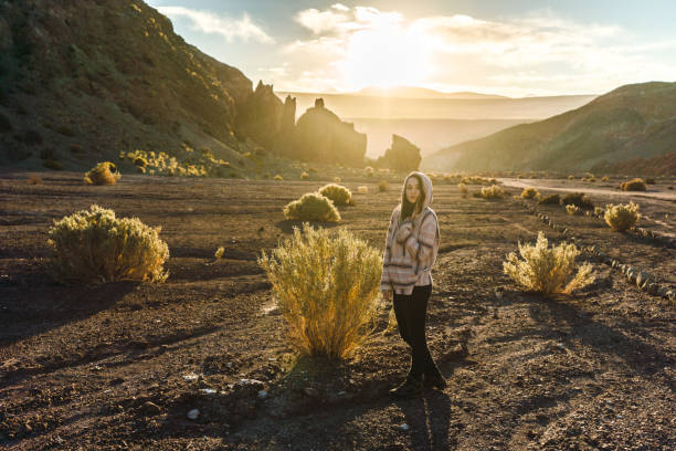 istock Woman walking in Atacama desert in Chile 1200334818