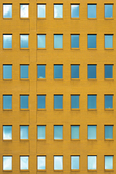 istock Windows of a brick building texture. Abstraction. 1200335741