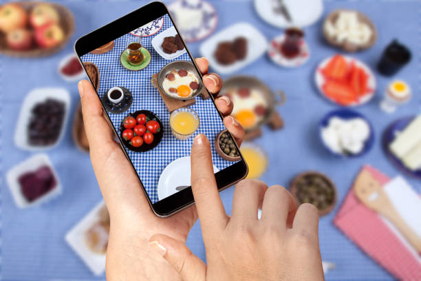 istock taking a photo of breakfast table 1200335763