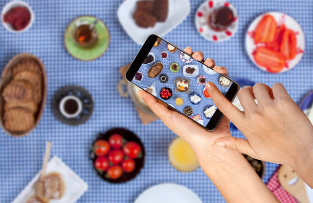 istock taking a photo of breakfast table 1200335888