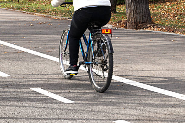 istock woman rides a bicycle 1200338614
