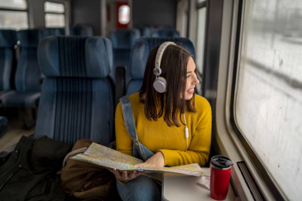 istock Young woman traveling by train 1200338799