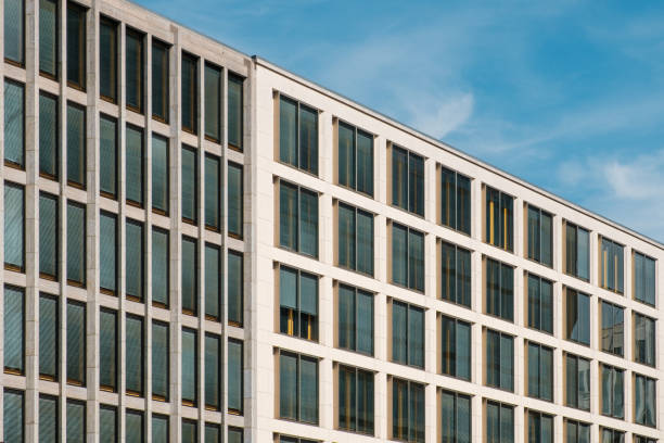 istock perspective view of modern office buildings and blue sky 1200341746