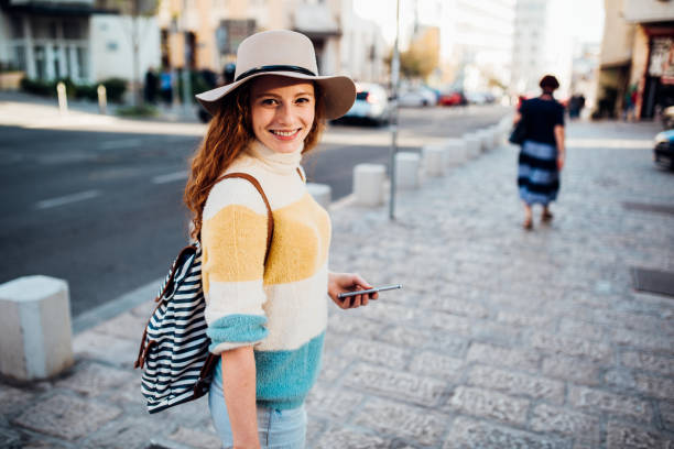 istock Happy traveler enjoying her vacation 1200342880