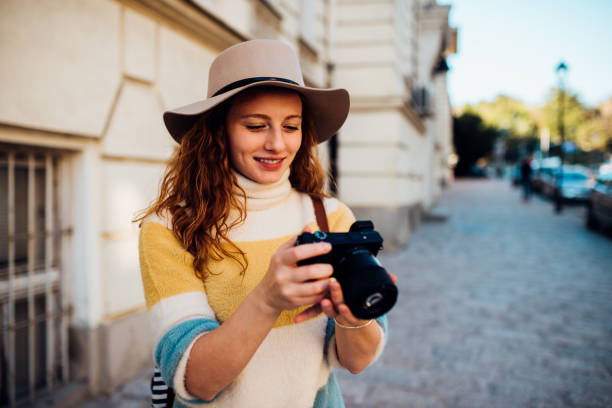 istock Young tourist photographing on the move 1200342892