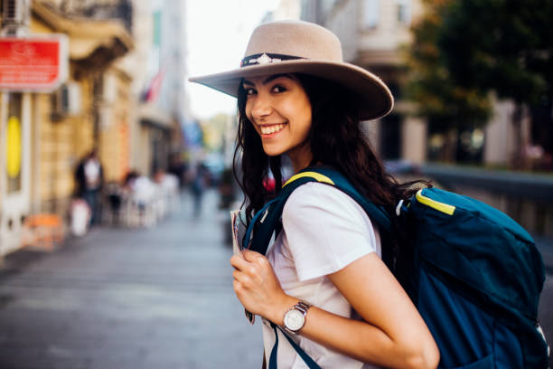istock Girl with a backpack enjoying her adventure 1200343003