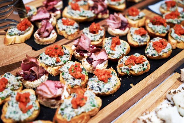 istock Canapes and appetizers on a table, close up. Catering service buffet 1200344592