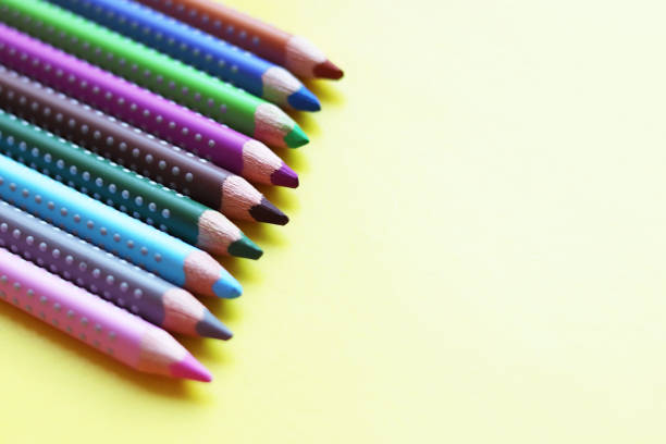 istock Colored pencils on yellow background . Back to school , copy space 1200345627