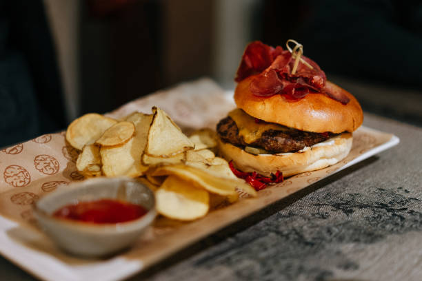 istock Close-Up Of Burger In Plate On Table 1200345810