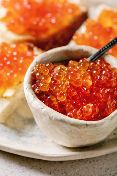 istock Red caviar with bread and butter 1200347258