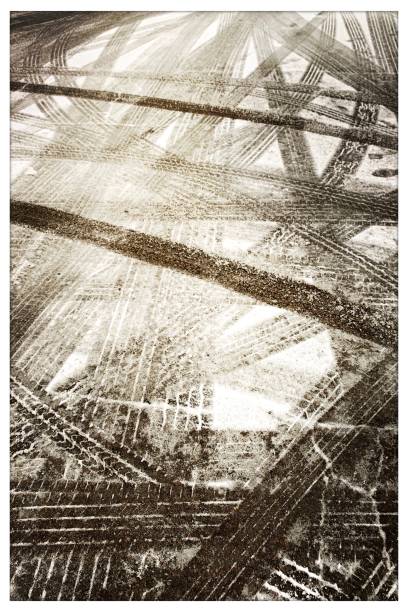 istock Tire Tracks in the Snow 1200352396