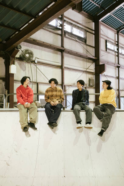 istock Skaters hanging out at a skatepark 1200355949