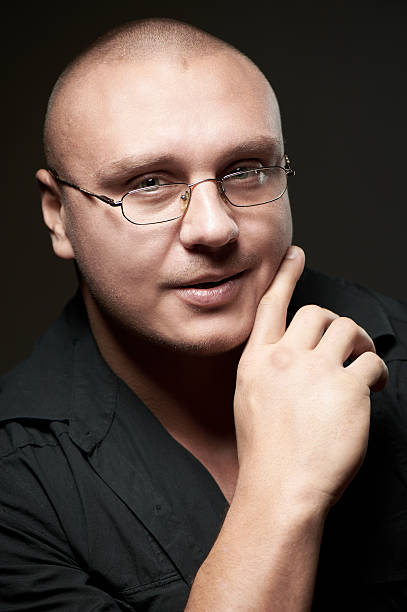 Positive portrait of serious man in eyeglasses stock photo