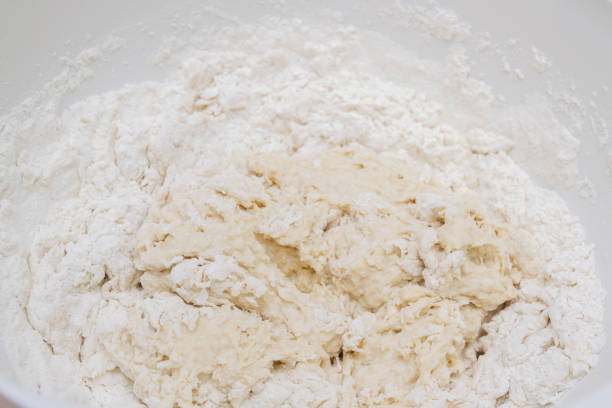 istock Cooking dough in a white plastic bowl at home 1200358304