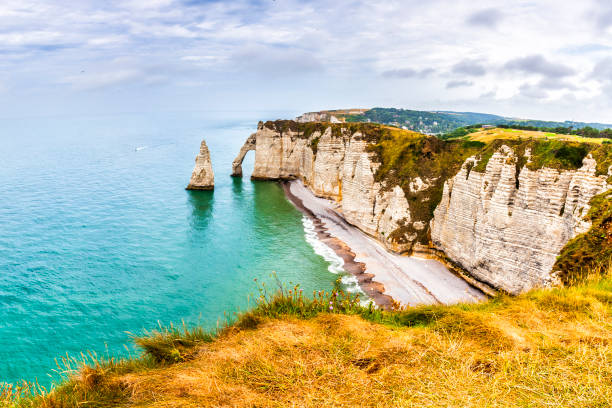 istock Panorama of natural chalk cliffs of Etretat 1200358336