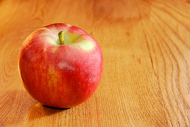 istock Cortland apple on wooden table 120036540