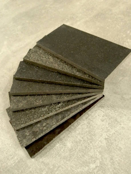 istock sample of black granite on a grey marble 1200365518