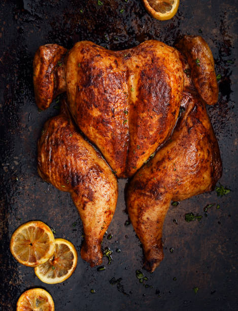 butterflied gebratenes huhn - roast chicken chicken roasted lemon stock-fotos und bilder