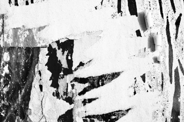 istock Blank white black old ripped torn paper crumpled creased posters grunge textures backdrop backgrounds placard 1200366485