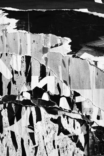 istock Blank white black old ripped torn paper crumpled creased posters grunge textures backdrop backgrounds placard 1200366490
