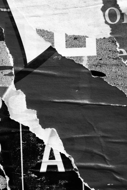 istock Blank white black old ripped torn paper crumpled creased posters grunge textures backdrop backgrounds placard 1200366578