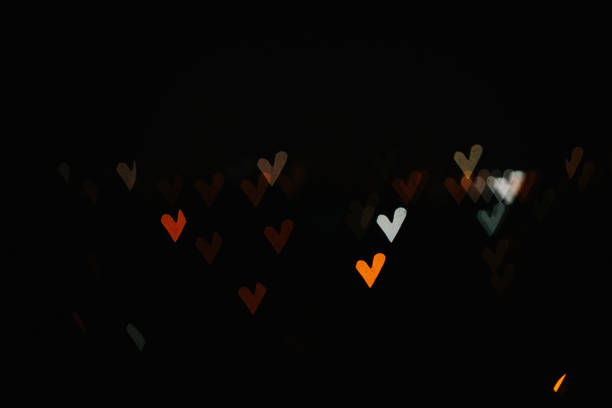 boken colorful hearts from the lights of the night city - boken heart imagens e fotografias de stock