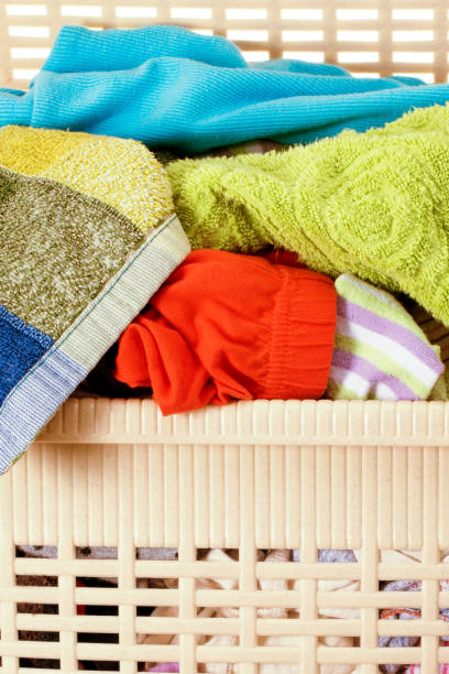 istock Laundry basket full of dirty washing 1200370537