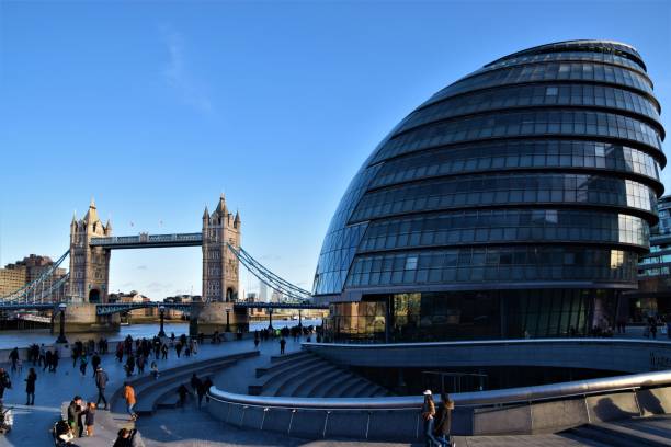 Tower Bridge and London City Hall London, United Kingdom - January 18 2020: Tower Bridge and City Hall daytime view with clear blue sky and people royal albert hall stock pictures, royalty-free photos & images