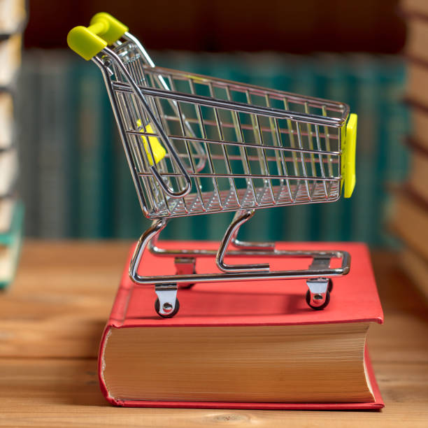 istock Books and a shopping cart 1200371325