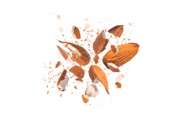 istock Almonds crushed into pieces close-up on white background 1200372431