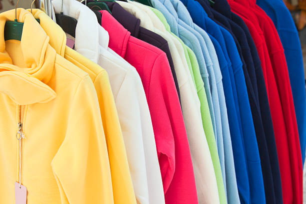 istock multicolor sport shirts hanging in store 120037351
