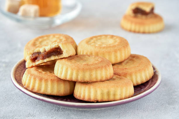 istock Traditional arabic sweets with dates and walnut. Maaamoul cookies 1200375289