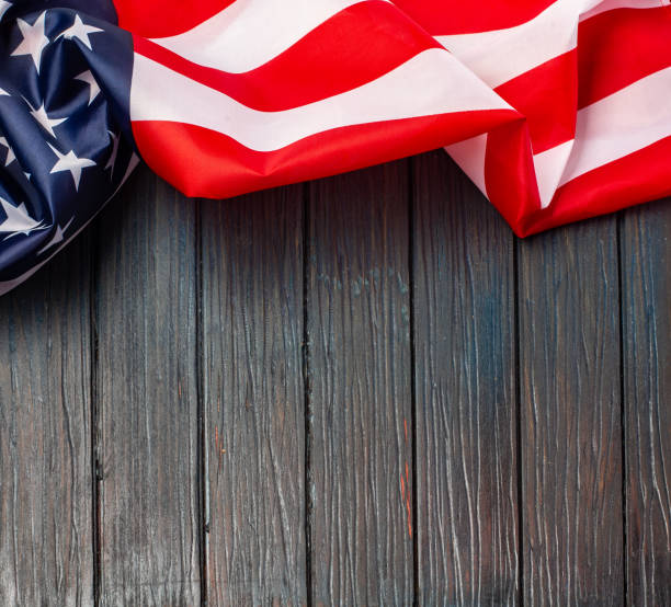 istock US flag on wooden background. 1200378645
