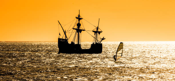 Beautiful silhouette view of a replica of the Santa Maria Beautiful silhouette view of a replica of the Santa Maria tallship of Columbus, sailing the Atlantic ocean around Madeira island in summer at sunset funchal christmas stock pictures, royalty-free photos & images