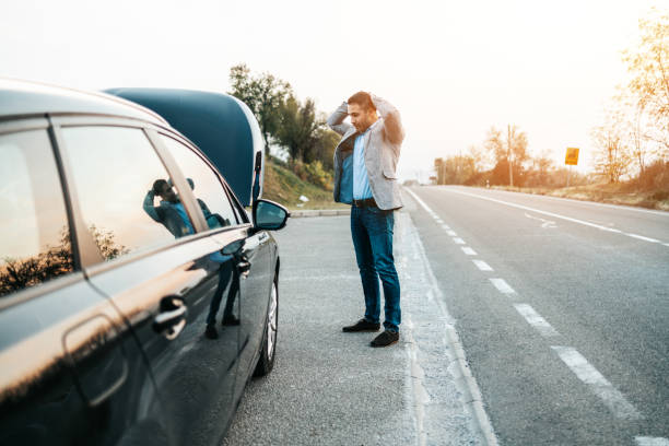 Roadside assistance Car issue breakdown or engine failure. Elegant middle age man waiting for towing service for help car accident on the road. Roadside assistance concept. towing photos stock pictures, royalty-free photos & images
