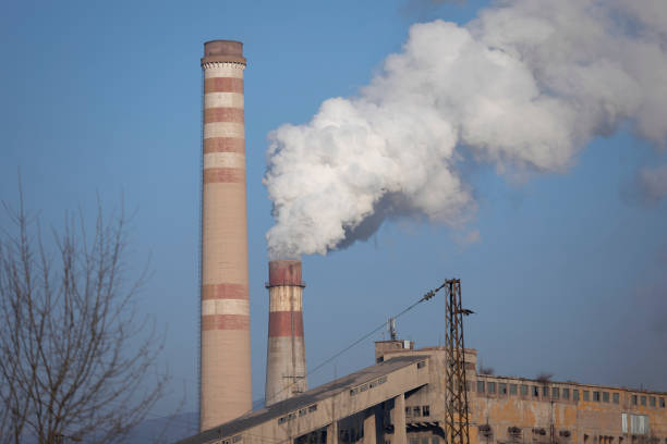 istock Smoking chimney and electric pole 1200381071