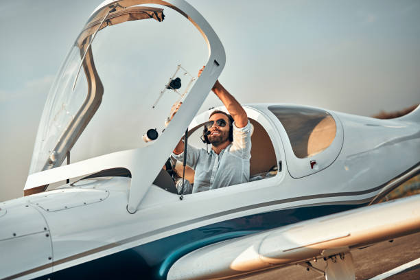 istock Pilot closing light aircraft cockpit at small airport 1200382248