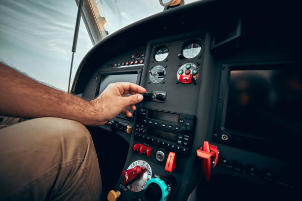 istock Pilot inside a cockpit small airplane. Pilots hand on the controls 1200383600