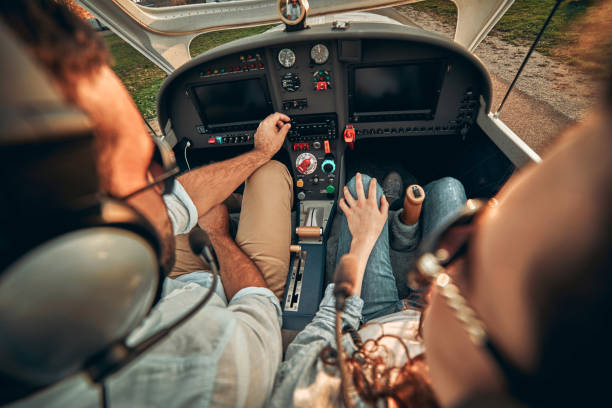 istock Rear view of pilot and copilot operating controls of private plane 1200383619