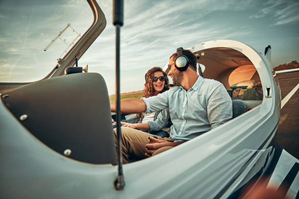 istock Couple in love in a small private airplane 1200383623