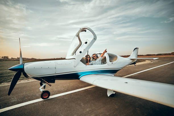 istock Beautiful couple in love in a small private plane 1200383631