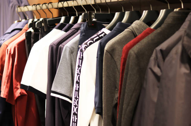 istock men's clothes on hangers in a store 1200385504